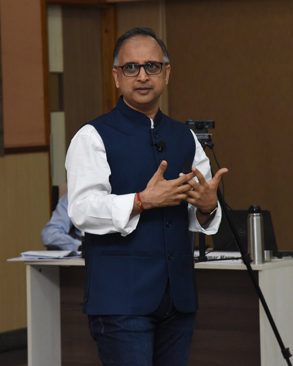 Kamlesh Jain speaking at a conference